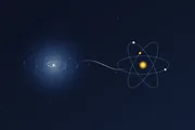 An abstract spiral galaxy joined by a luminous seam to a gold-nucleus atom, illustrating AWS as grand-scale math and Kubernetes as small-scale physics, two ends of one spectrum