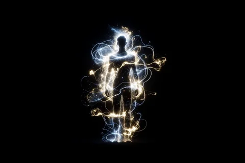 A human silhouette haloed by an exosuit of light in the dark, evoking amplified capability rather than replacement