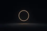 A glowing closed loop of light in the dark, evoking a specify-generate-verify feedback cycle