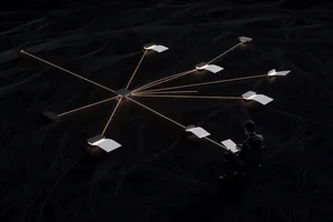 A single voice line entering a small router that fans out to a few specialist roles, each producing a clean document, with one short daily brief returning to a calm figure.