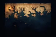 A weathered nautical chart of a complex coastline laid over dark ocean water, every rock and depth still marked, illustrating legibility rather than simplification