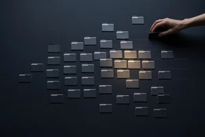 An overhead view of dozens of small folders scattered across a dark surface, most dim and one cluster lit warm, as a hand sorts them into three labeled lanes.