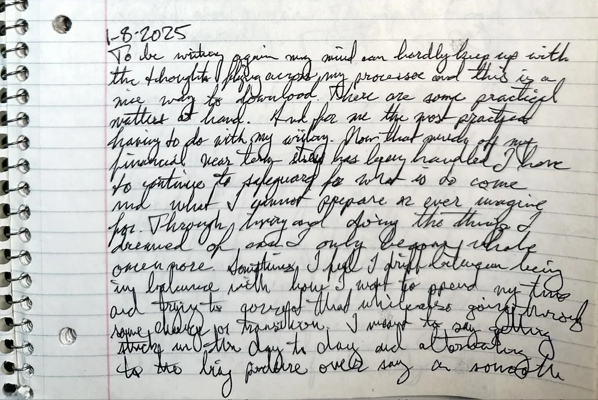 Spiral notebook page dated 1-8-2025, dense black cursive across lined paper beside the coil binding