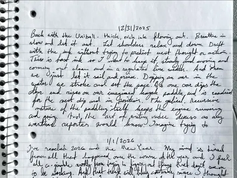 The December 31 handwritten entry: Back with the Uniball, thick, rich ink flowing out, with the first lines of January 1 below it.